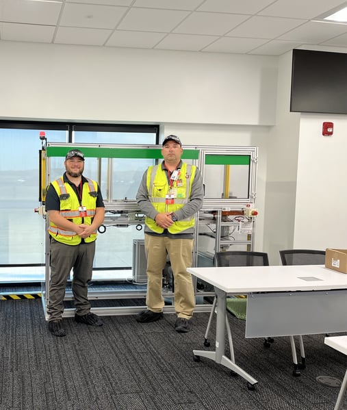 The completed lockout/tagout trainer with the OTC project team on-site