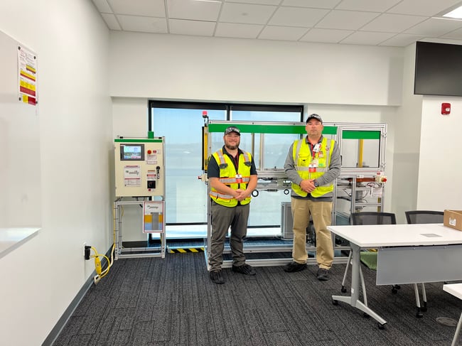 the completed lockout/tagout trainer with the OTC project team on-site.