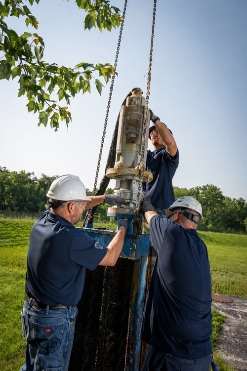 service technician on-site at a municipal lift station