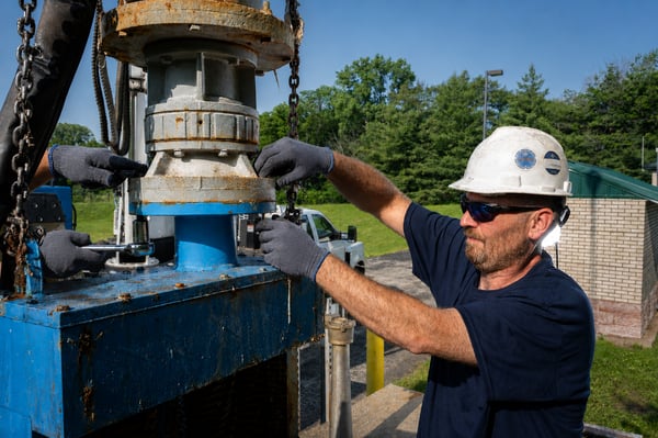 technician performing hands-on inspection.